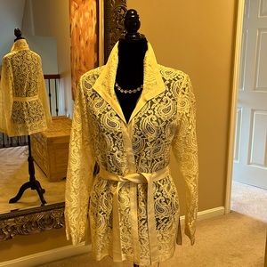 Elegant cream Lace top/topper with ribbon trim and belt and side slits.